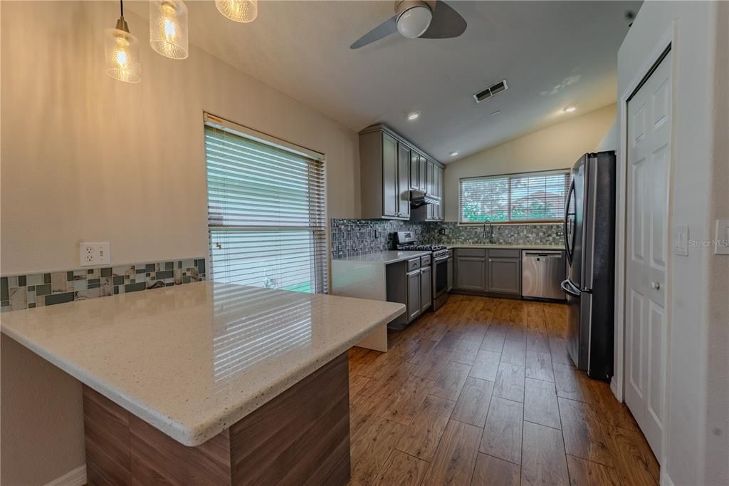 Interior, Kitchen, Recessed Lighting, Stainless Steel Appliances, Wood Texture Flooring