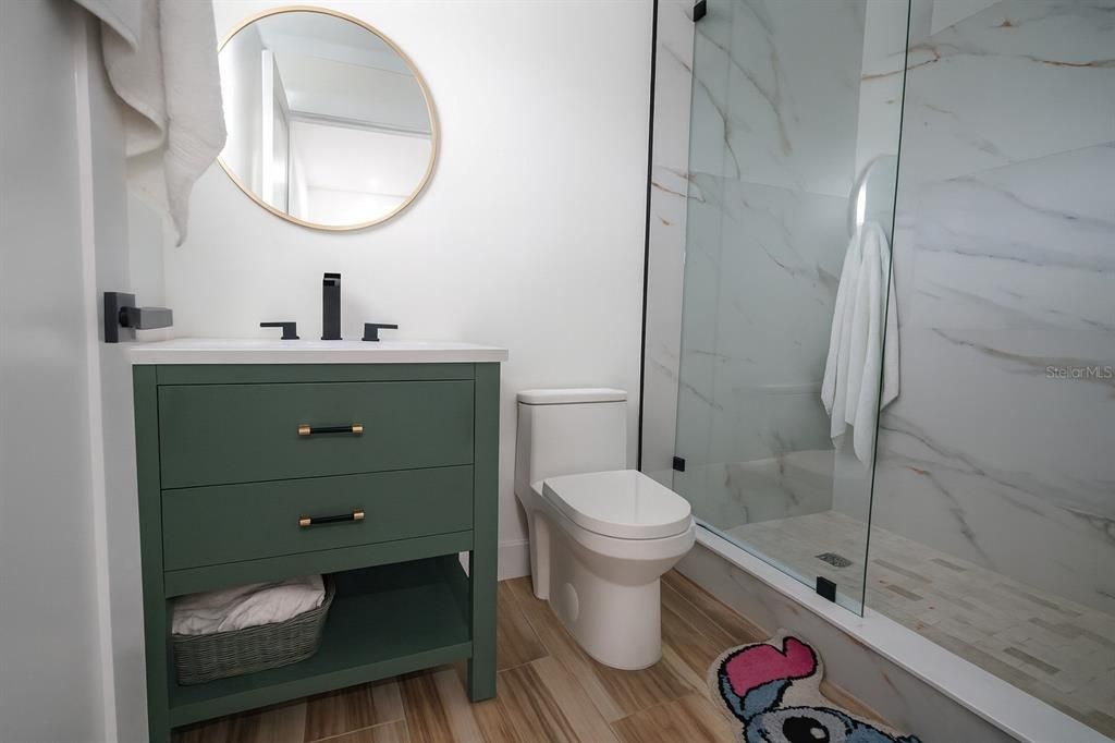 Bathroom, Glass Shower, Interior, Marble Walls, Wood Texture Flooring