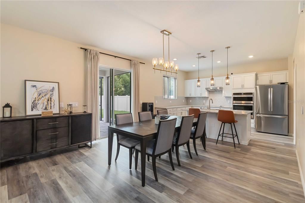 Dining room, Interior, Kitchen, Pendant Lights, Recessed Lighting, Stainless Steel Appliances, Wood Texture Flooring