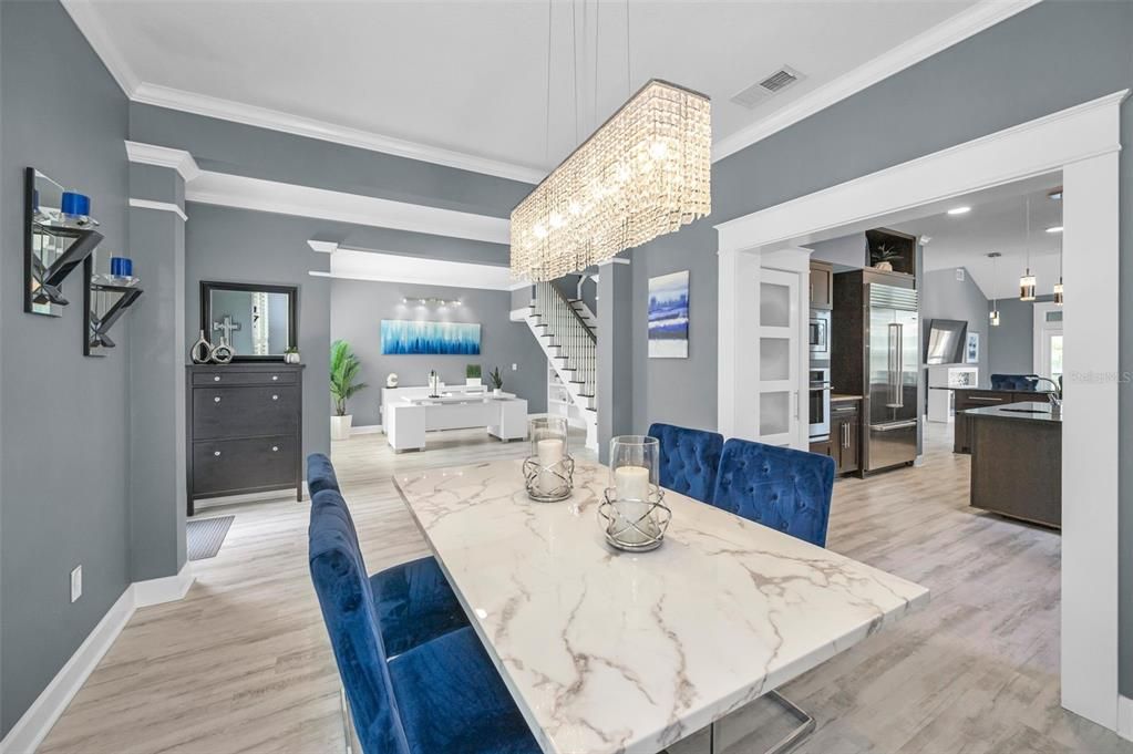 Chandelier, Dining room, Interior, Kitchen, Pendant Lights, Recessed Lighting, Stainless Steel Appliances, Wood Texture Flooring