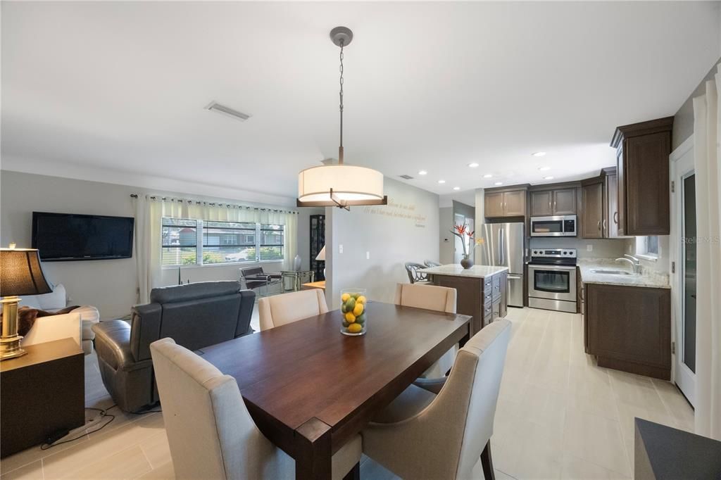 Dining room, Interior, Kitchen, Living room, Pendant Lights, Recessed Lighting, Stainless Steel Appliances, Wood Texture Flooring