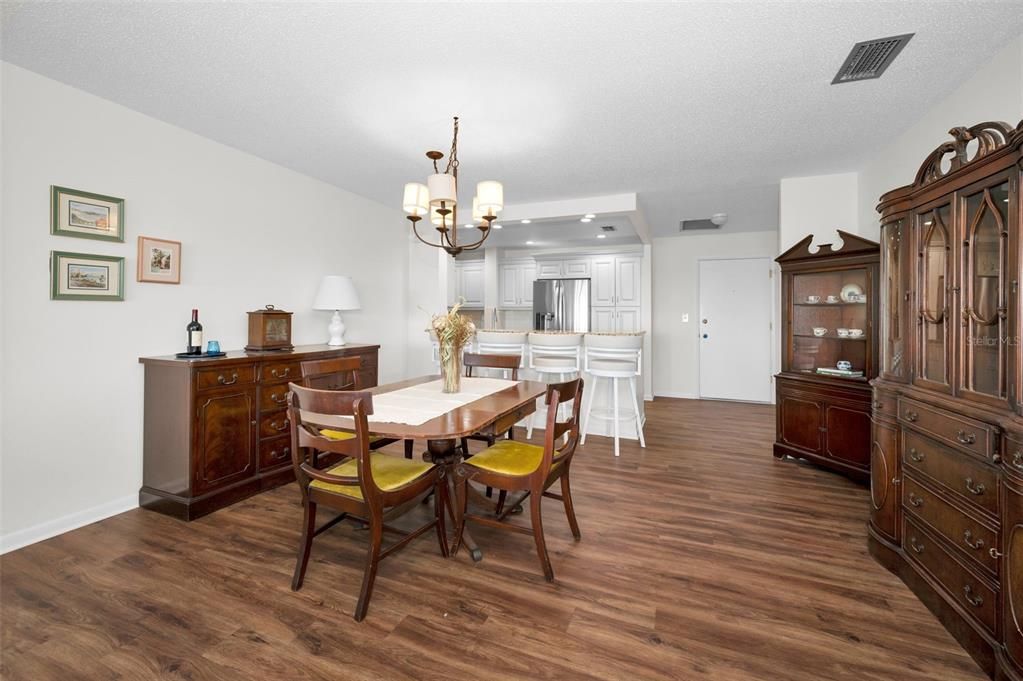 Chandelier, Dining room, Interior, Kitchen, Recessed Lighting, Stainless Steel Appliances, Wood Texture Flooring