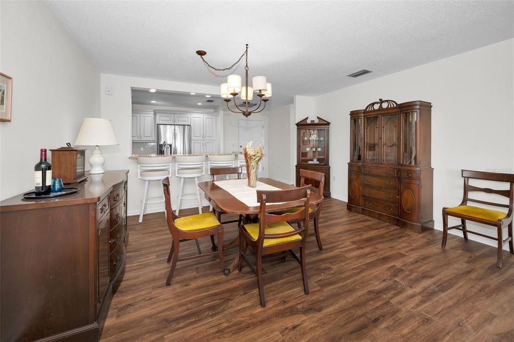 Chandelier, Dining room, Interior, Kitchen, Recessed Lighting, Stainless Steel Appliances, Wood Texture Flooring