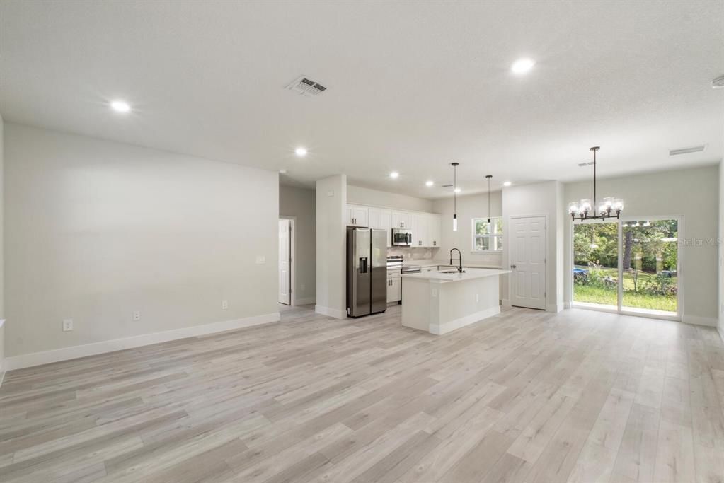 Chandelier, Empty room, Interior, Kitchen, Pendant Lights, Recessed Lighting, Wood Texture Flooring
