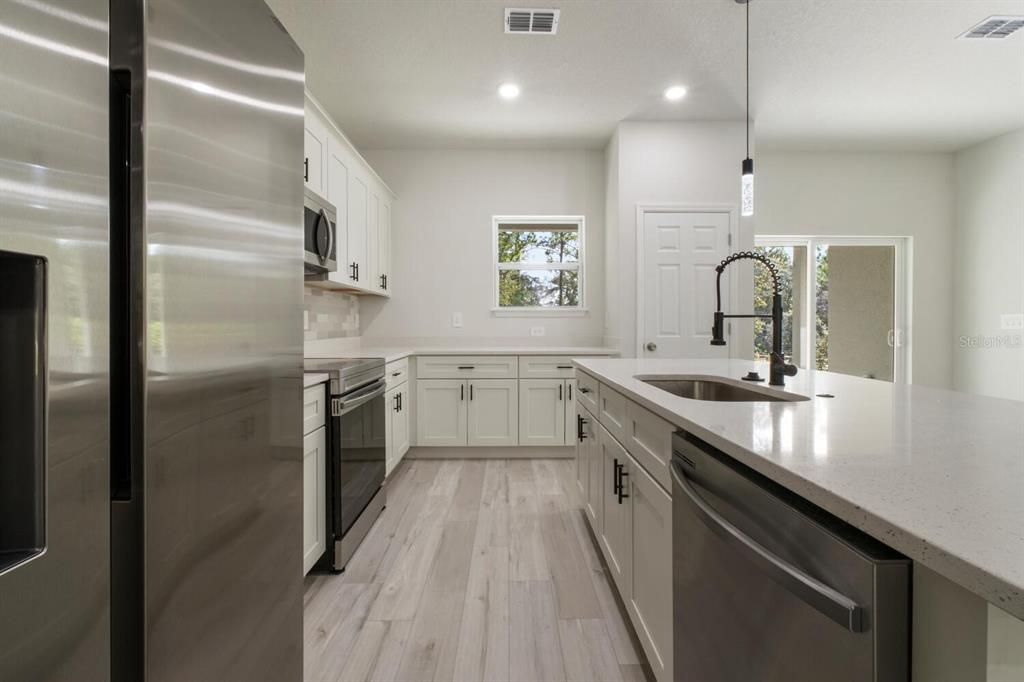 Interior, Kitchen, Pendant Lights, Recessed Lighting, Stainless Steel Appliances, Wood Texture Flooring