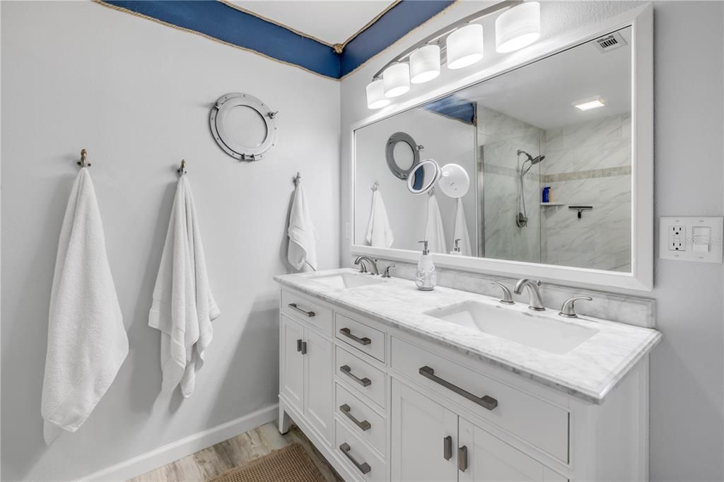 Bathroom, Dual Sink Vanities, Interior, Marble Walls, Wood Texture Flooring