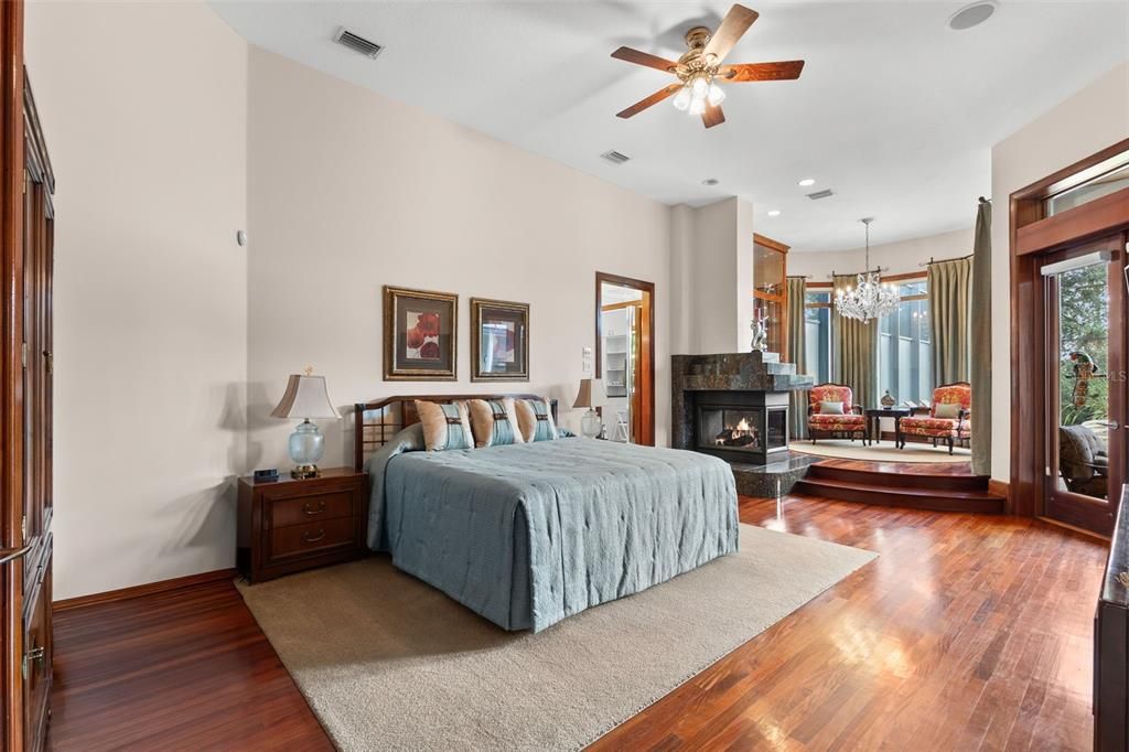 Bedroom, Chandelier, Fireplace, Interior, Recessed Lighting, Wood Texture Flooring