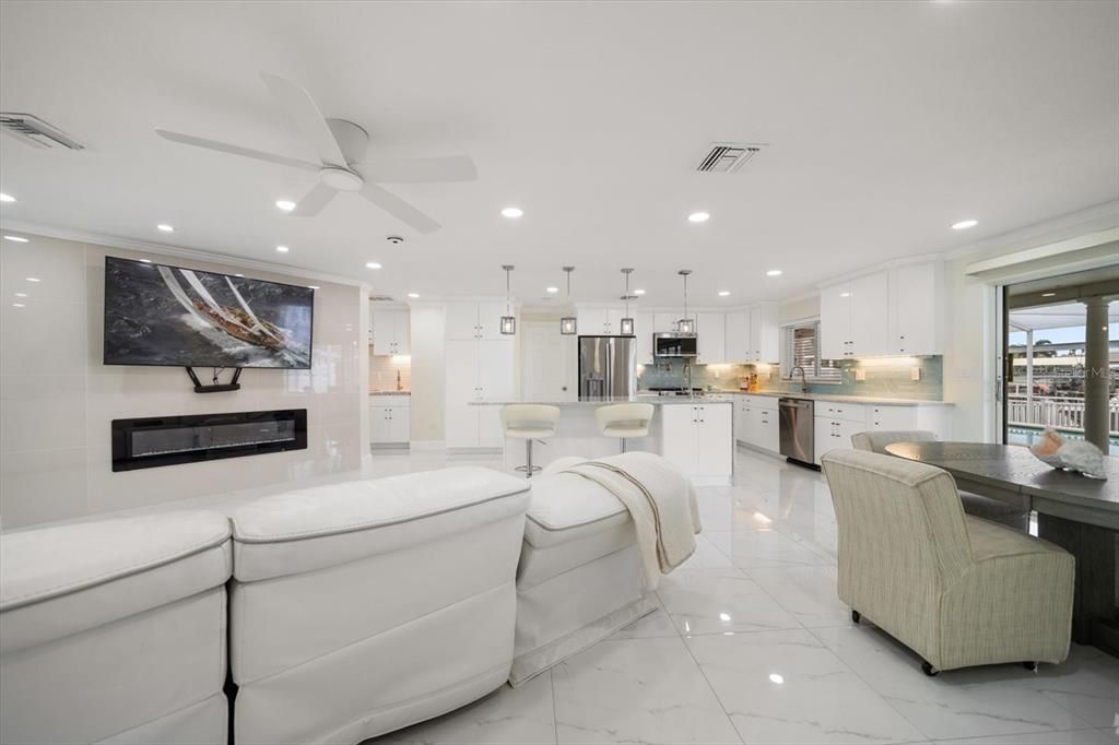 Fireplace, Interior, Kitchen, Living room, Marble, Pendant Lights, Recessed Lighting, Stainless Steel Appliances