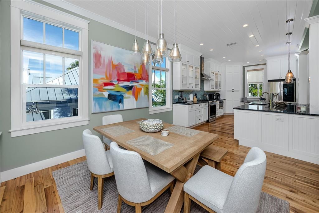 Dining room, Interior, Kitchen, Pendant Lights, Recessed Lighting, Stainless Steel Appliances, Wood Texture Flooring
