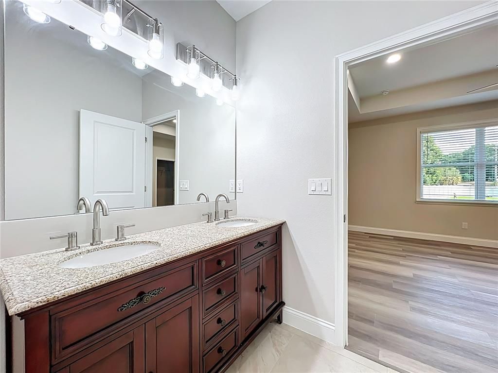 Bathroom, Dual Sink Vanities, Interior, Recessed Lighting, Wood Texture Flooring