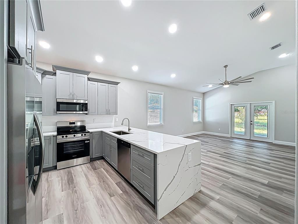 Interior, Kitchen, Recessed Lighting, Stainless Steel Appliances, Wood Texture Flooring