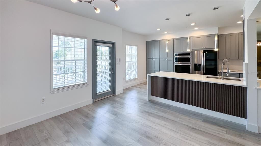 Interior, Kitchen, Pendant Lights, Recessed Lighting, Stainless Steel Appliances, Wood Texture Flooring