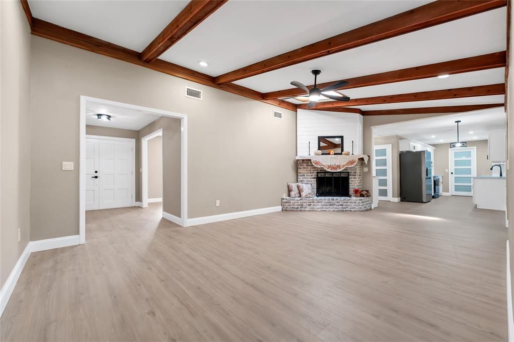 Empty room, Fireplace, Interior, Pendant Lights, Recessed Lighting, Wooden Beams, Wood Texture Flooring