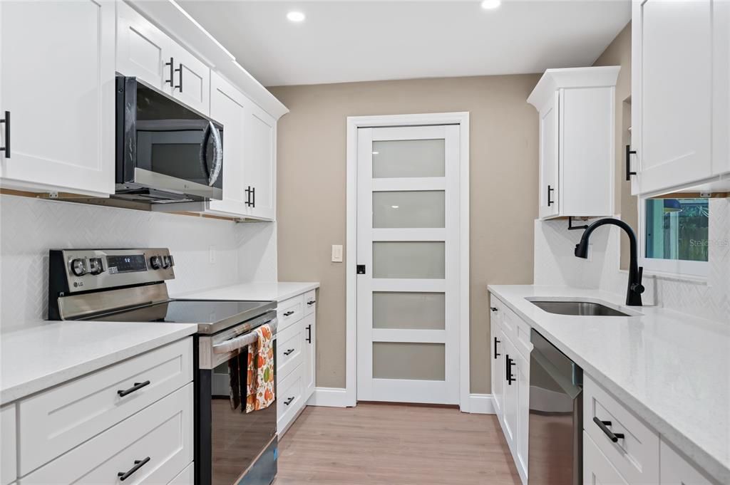 Interior, Kitchen, Recessed Lighting, Stainless Steel Appliances, Wood Texture Flooring