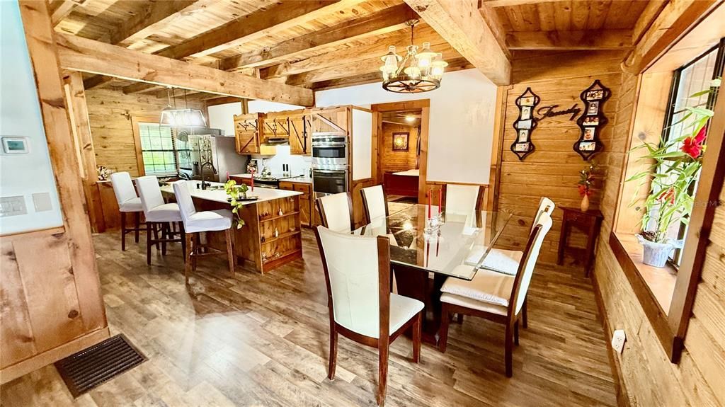 Chandelier, Dining room, Interior, Kitchen, Pendant Lights, Stainless Steel Appliances, Wooden Beams, Wooden Ceilings, Wood Texture Flooring, Wooden Walls