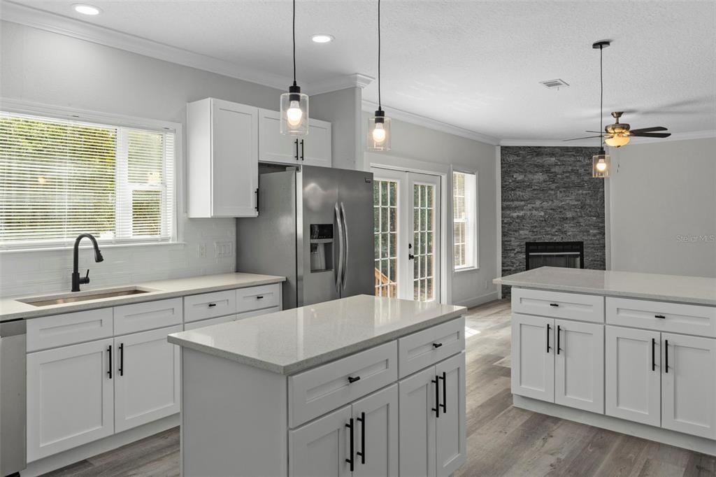 Fireplace, Interior, Kitchen, Pendant Lights, Recessed Lighting, Stone Walls, Wood Texture Flooring