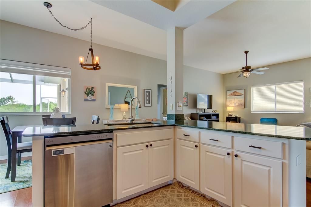 Chandelier, Dining room, Interior, Kitchen, Pendant Lights, Stainless Steel Appliances, Wood Texture Flooring