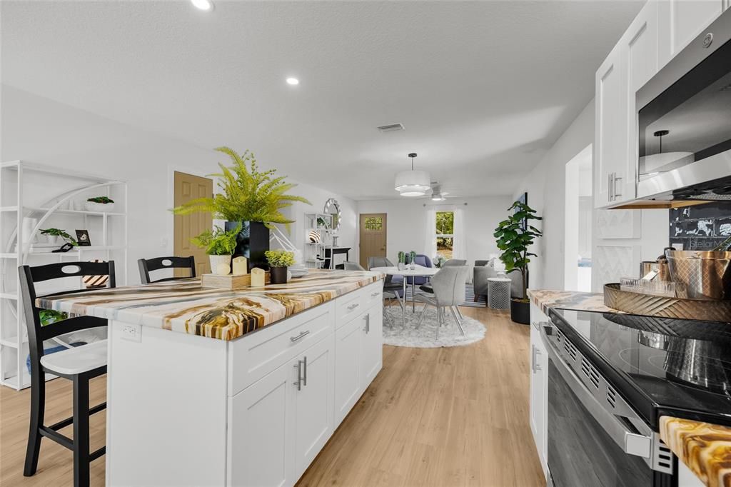 Dining room, Interior, Kitchen, Recessed Lighting, Stainless Steel Appliances, Wood Texture Flooring