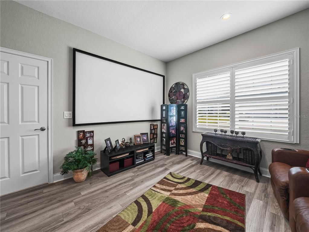 Fireplace, Interior, Projection Screen, Recessed Lighting, Wood Texture Flooring
