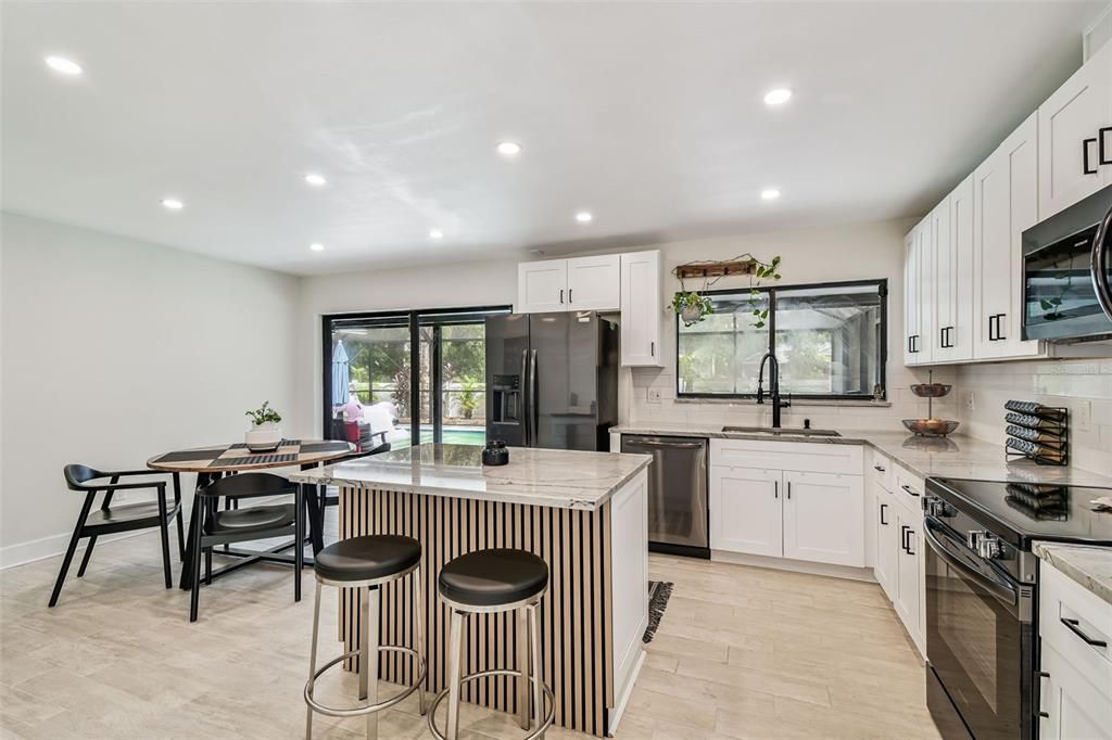 Dining room, Interior, Kitchen, Recessed Lighting, Stainless Steel Appliances, Wood Texture Flooring