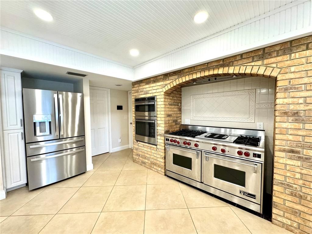 Interior, Kitchen, Recessed Lighting, Stainless Steel Appliances, Stone Walls