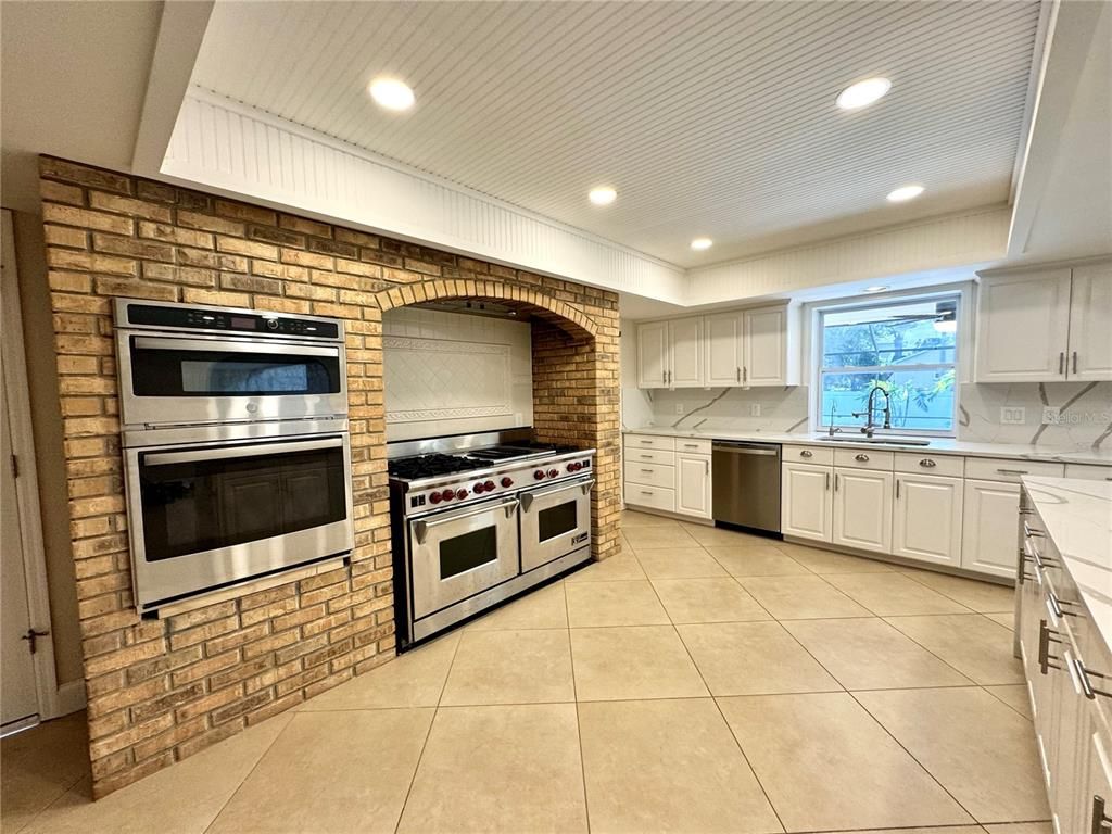 Interior, Kitchen, Recessed Lighting, Stainless Steel Appliances, Stone Walls