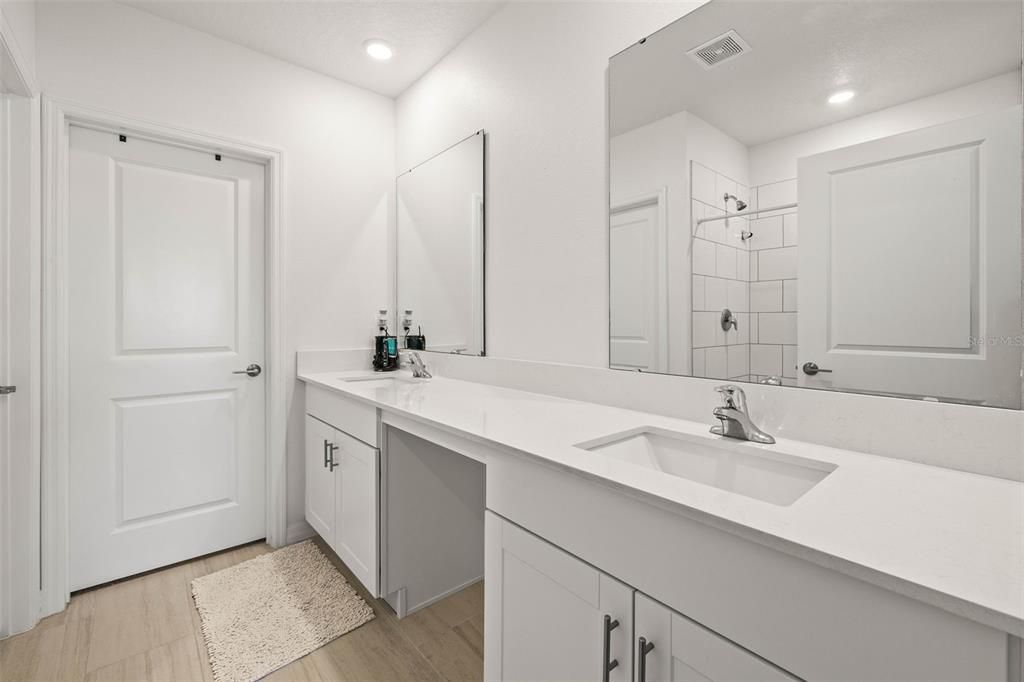Bathroom, Dual Sink Vanities, Interior, Recessed Lighting, Wood Texture Flooring