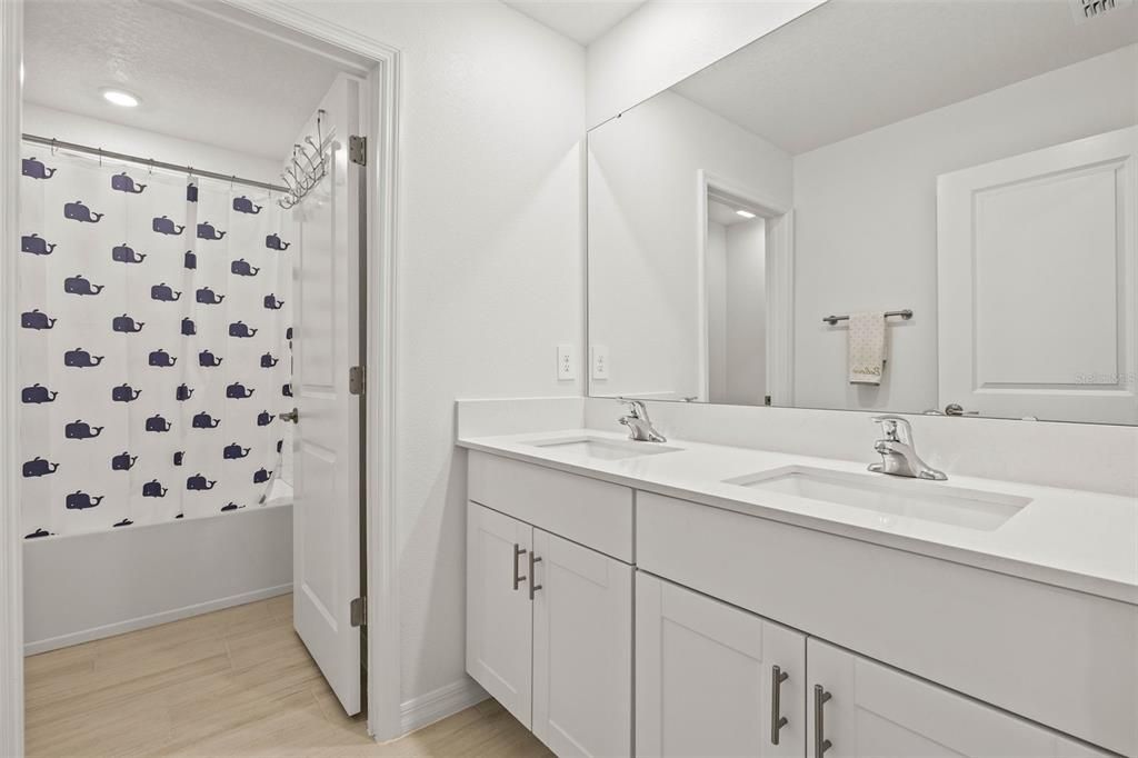 Bathroom, Dual Sink Vanities, Interior, Recessed Lighting, Wood Texture Flooring
