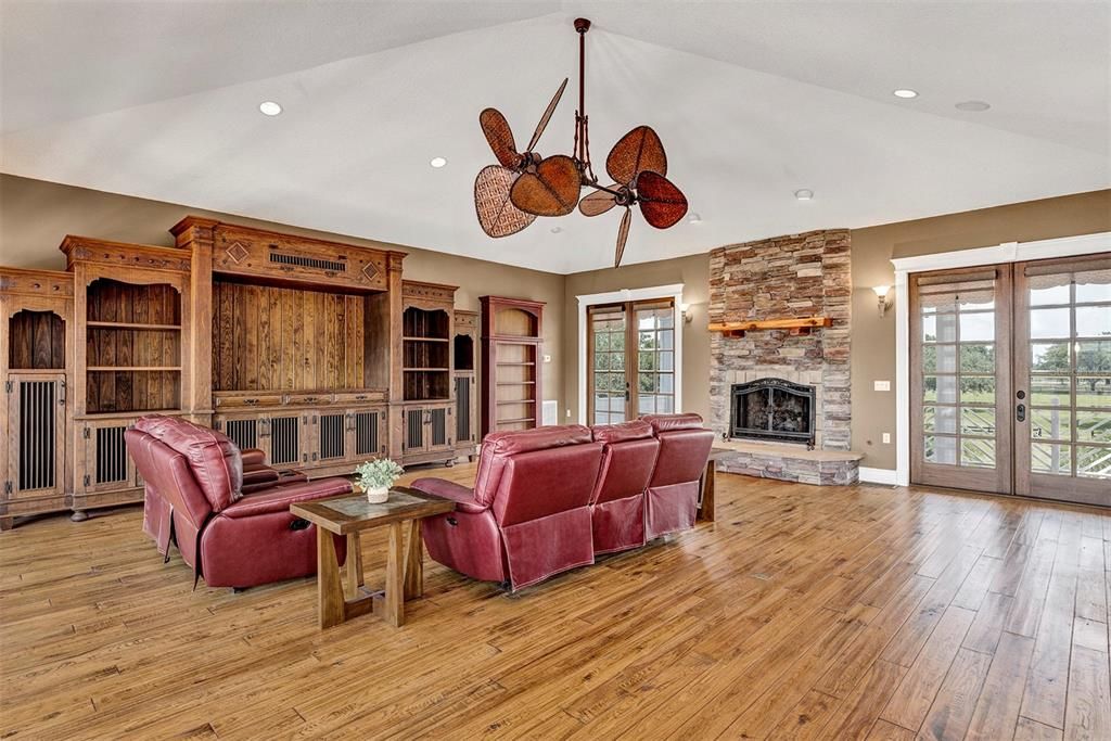 Fireplace, Interior, Living room, Recessed Lighting, Stone Walls, Wood Texture Flooring