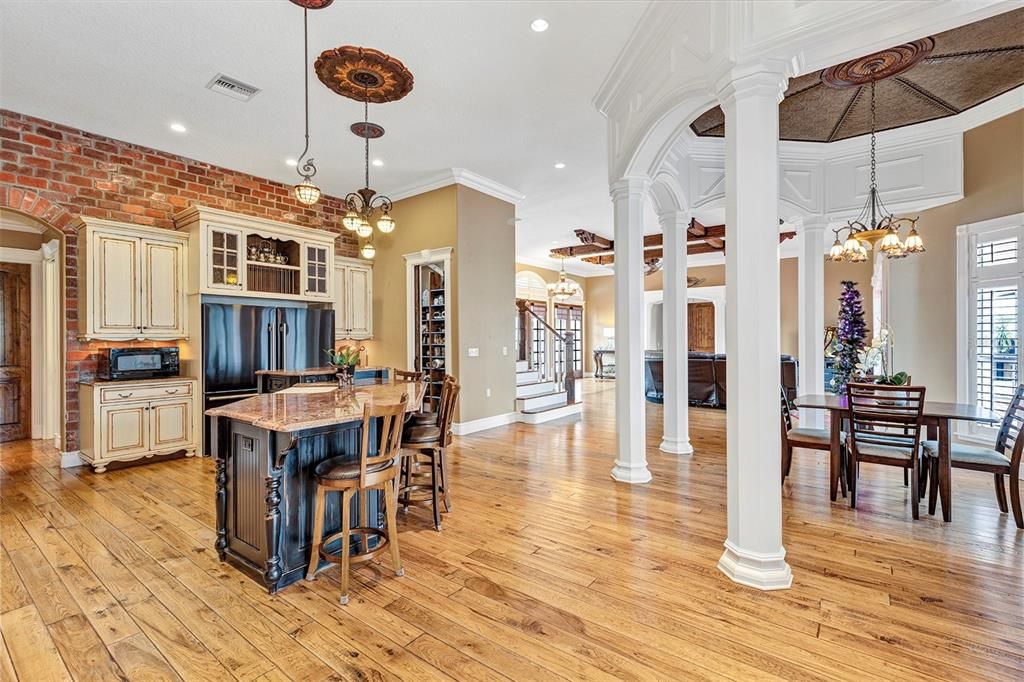 Chandelier, Dining room, Interior, Kitchen, Pendant Lights, Recessed Lighting, Stone Walls, Wood Texture Flooring