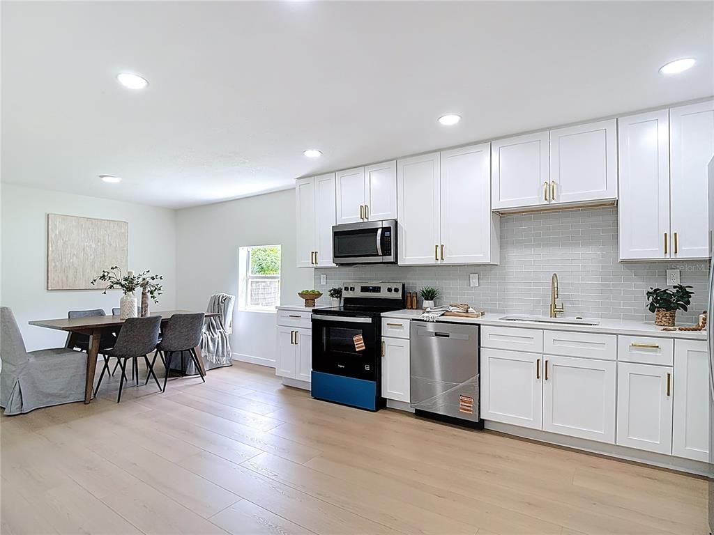 Dining room, Interior, Kitchen, Recessed Lighting, Stainless Steel Appliances, Wood Texture Flooring