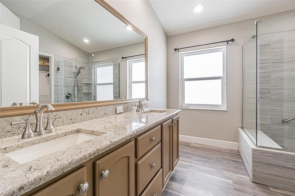 Bathroom, Dual Sink Vanities, Glass Shower, Interior, Recessed Lighting, Wood Texture Flooring