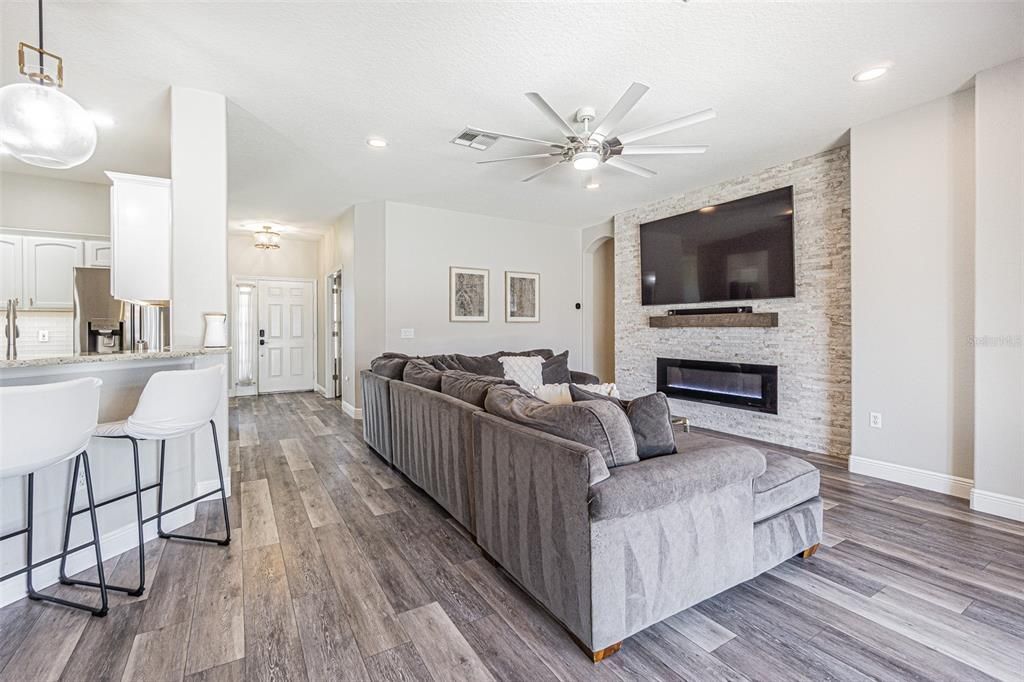 Fireplace, Interior, Kitchen, Living room, Pendant Lights, Recessed Lighting, Stone Walls, Wood Texture Flooring