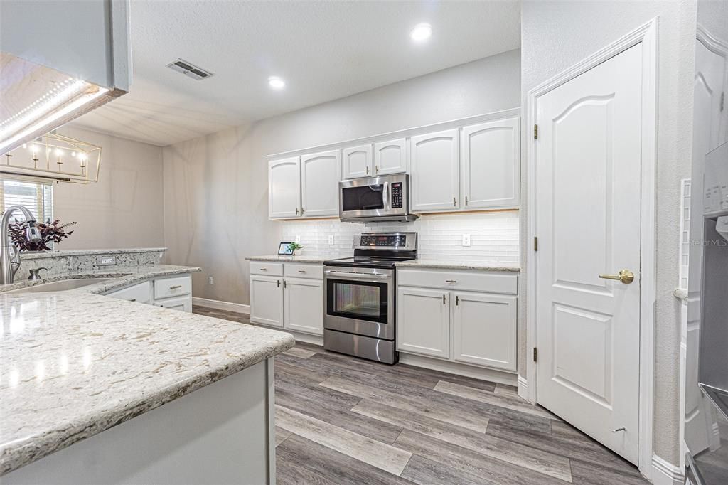 Interior, Kitchen, Recessed Lighting, Stainless Steel Appliances, Wood Texture Flooring