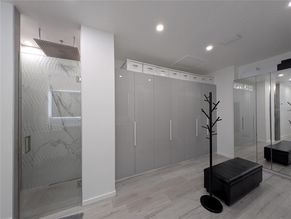 Bathroom, Glass Shower, Interior, Marble Walls, Recessed Lighting, Wood Texture Flooring