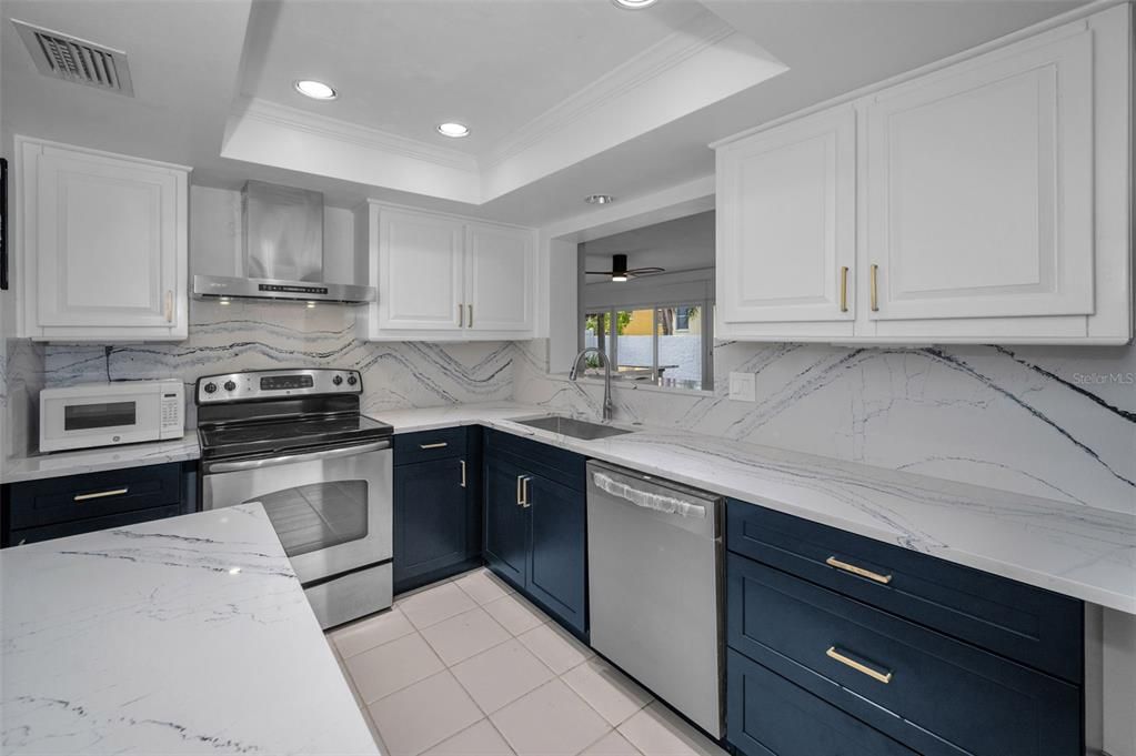 Interior, Kitchen, Marble Walls, Recessed Lighting, Stainless Steel Appliances