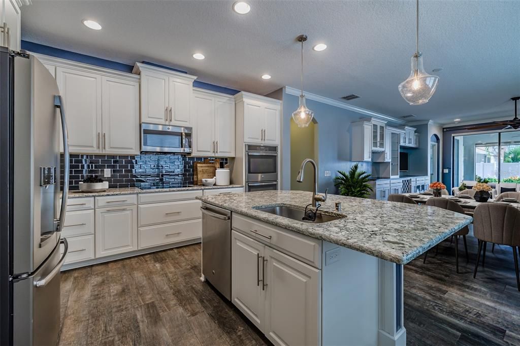 Dining room, Interior, Kitchen, Pendant Lights, Recessed Lighting, Stainless Steel Appliances, Wood Texture Flooring