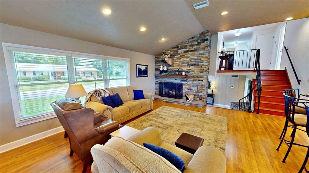 Fireplace, Interior, Living room, Recessed Lighting, Stone Walls, Wood Texture Flooring