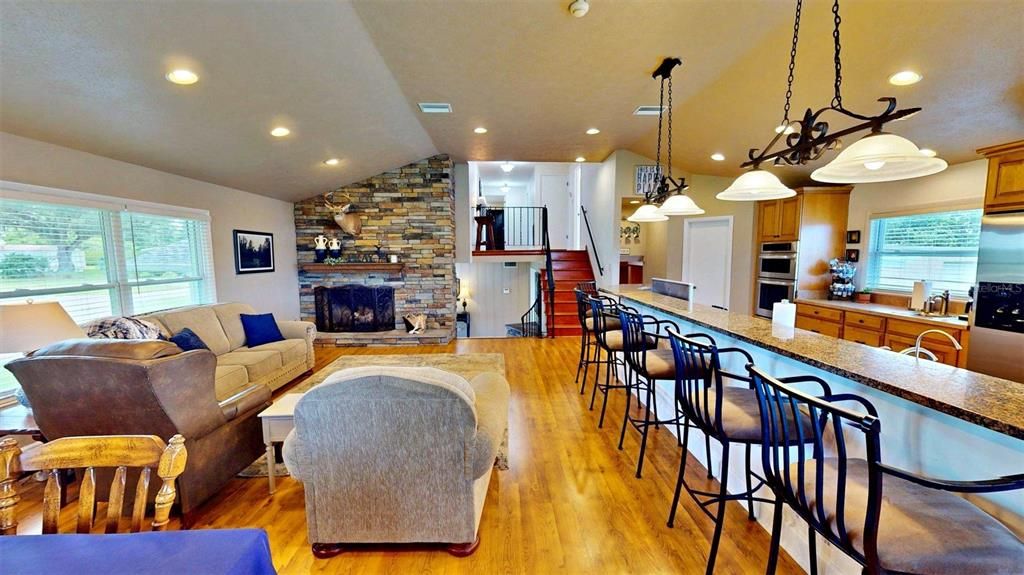 Fireplace, Interior, Kitchen, Living room, Pendant Lights, Recessed Lighting, Stone Walls, Wood Texture Flooring