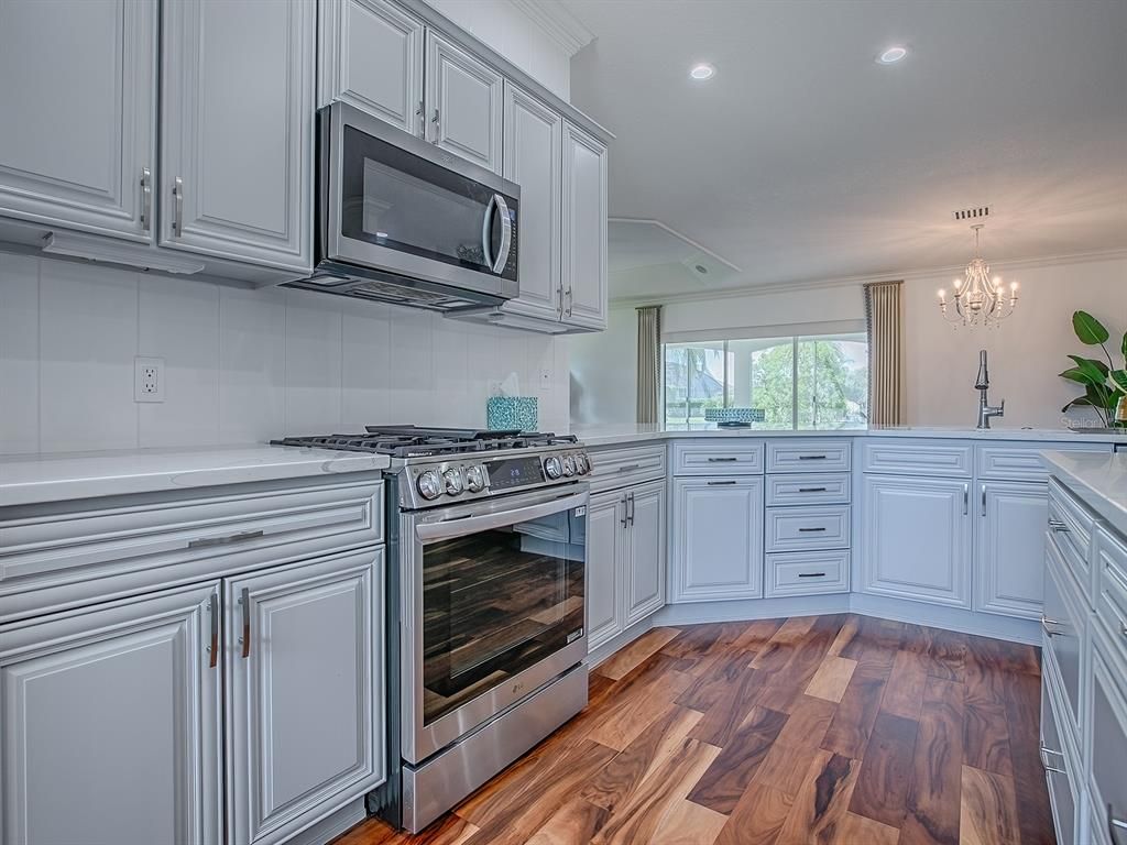 Chandelier, Interior, Kitchen, Recessed Lighting, Stainless Steel Appliances, Wood Texture Flooring