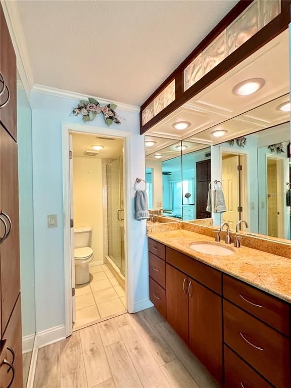 Bathroom, Dual Sink Vanities, Interior, Recessed Lighting, Wood Texture Flooring