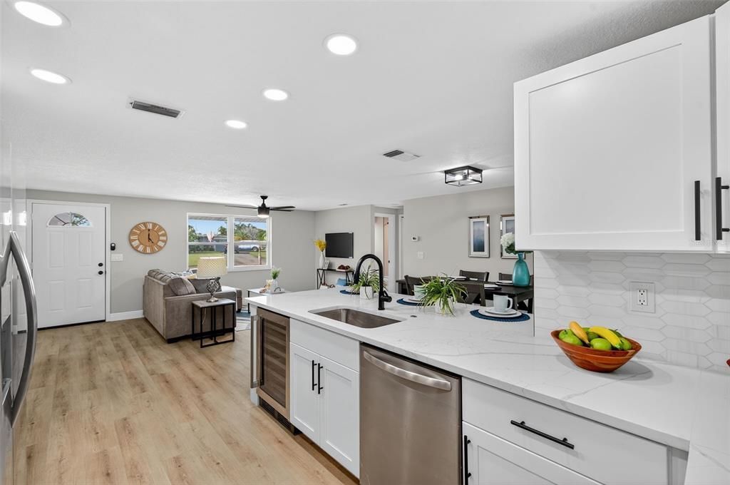 Dining room, Interior, Kitchen, Living room, Recessed Lighting, Stainless Steel Appliances, Wood Texture Flooring