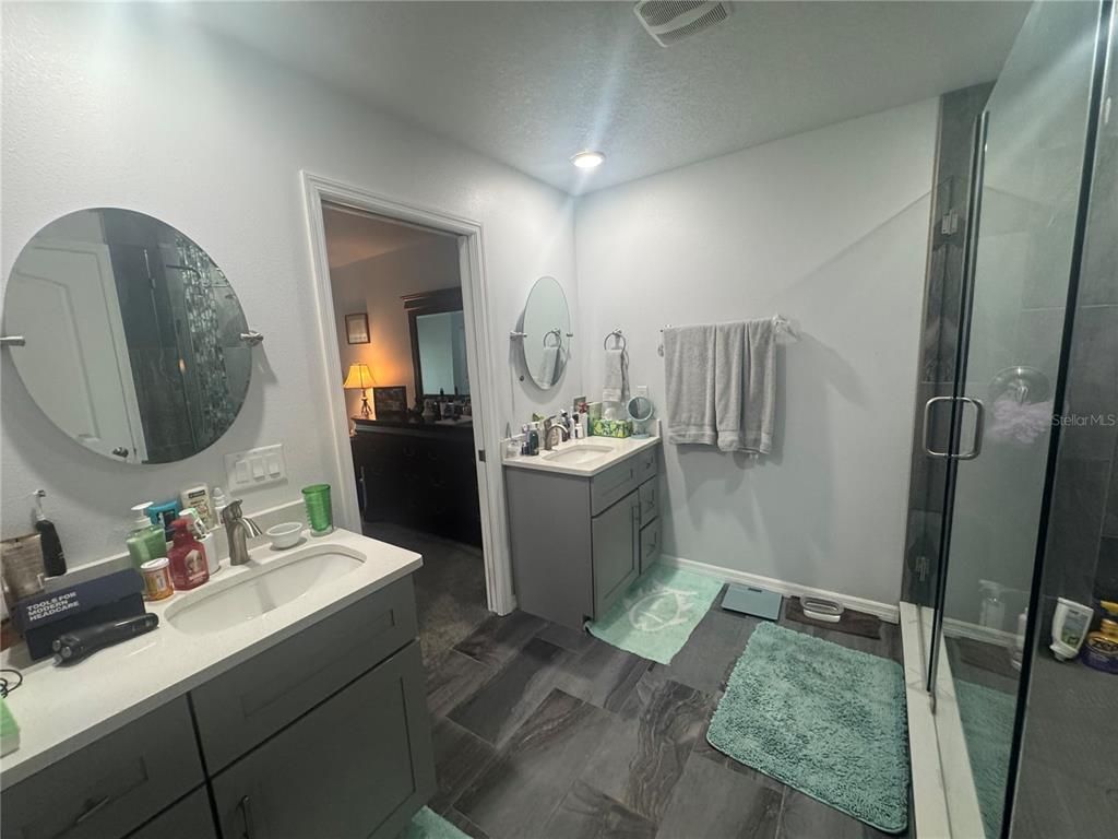 Bathroom, Dual Sink Vanities, Glass Shower, Interior, Recessed Lighting, Wood Texture Flooring
