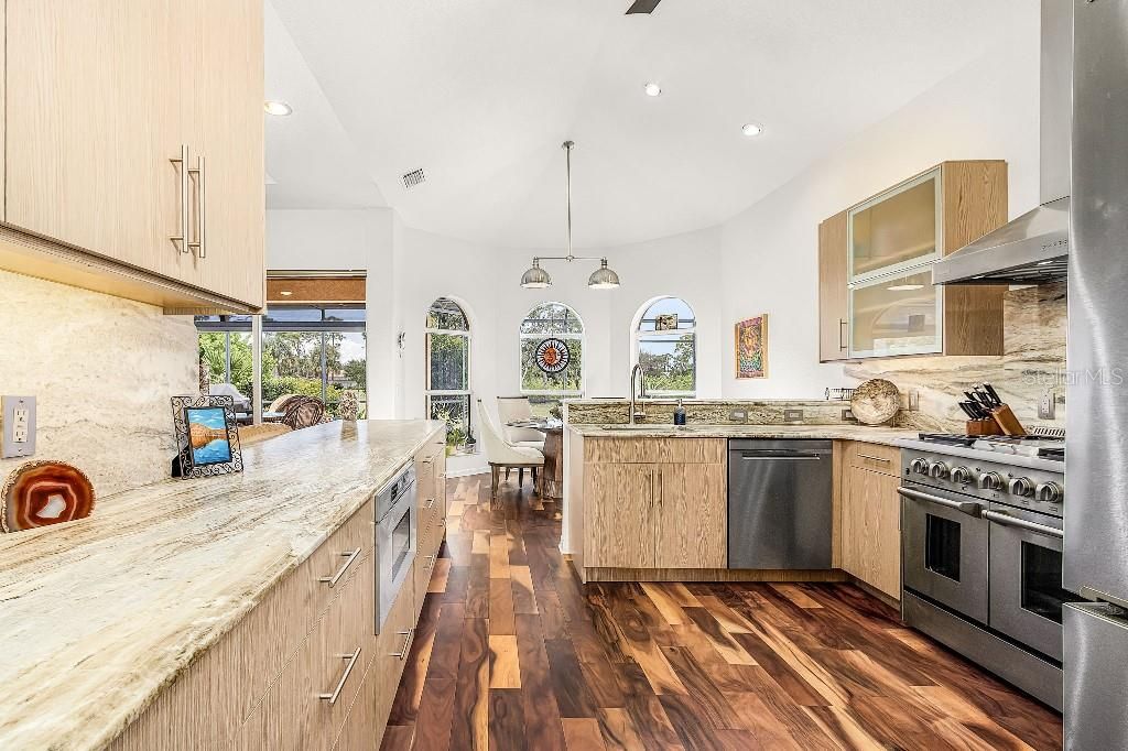 Dining room, Interior, Kitchen, Pendant Lights, Recessed Lighting, Stainless Steel Appliances, Wood Texture Flooring