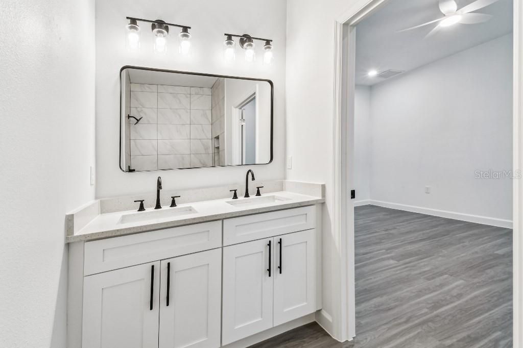 Bathroom, Dual Sink Vanities, Interior, Recessed Lighting, Wood Texture Flooring