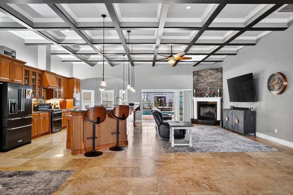 Fireplace, Interior, Kitchen, Pendant Lights, Recessed Lighting, Stainless Steel Appliances, Stone Walls