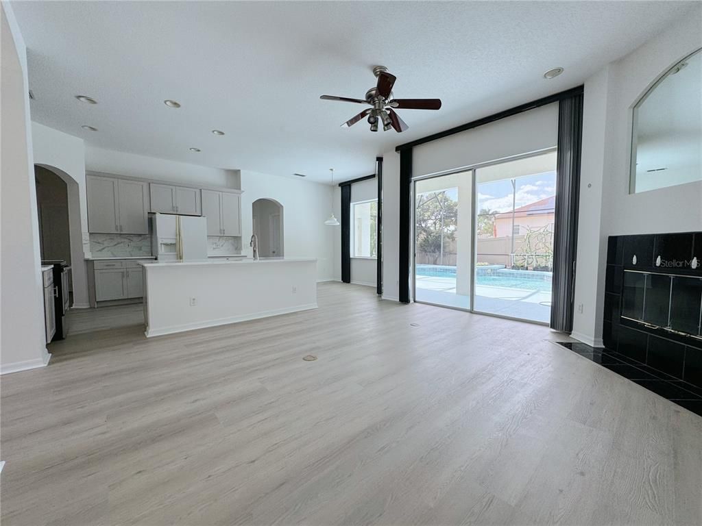 Empty room, Fireplace, Interior, Kitchen, Recessed Lighting, Wood Texture Flooring