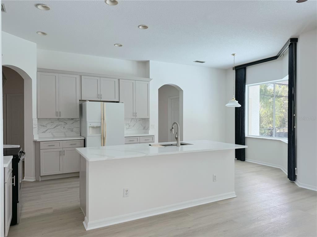 Interior, Kitchen, Marble Walls, Pendant Lights, Recessed Lighting, Wood Texture Flooring