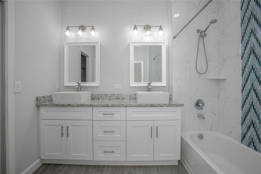 Bathroom, Dual Sink Vanities, Interior, Marble Walls, Wood Texture Flooring