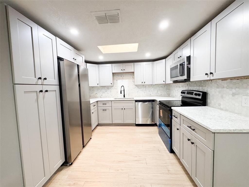 Interior, Kitchen, Recessed Lighting, Stainless Steel Appliances, Wood Texture Flooring